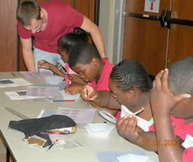 Summer intern, Grant Brock, answers questions from the students